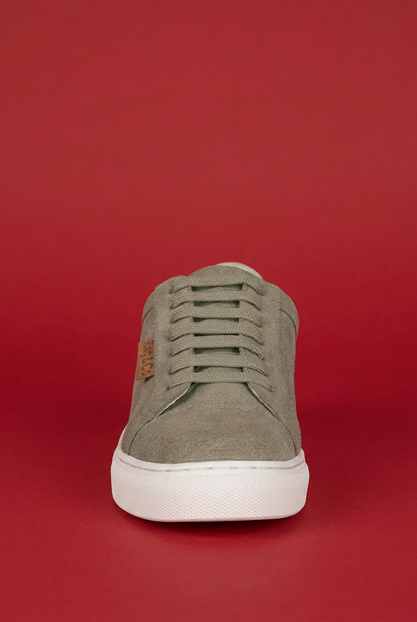 Beige Ashford sneaker front view on red background