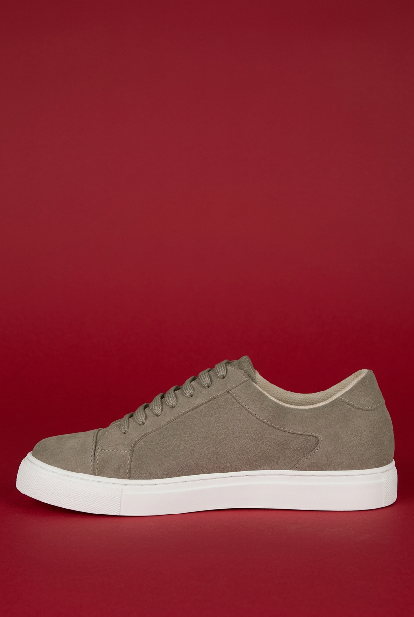 Beige Ashford sneaker inner side on red background
