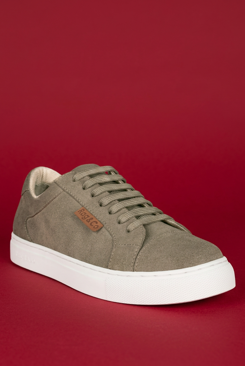 Beige Ashford sneaker angled view on red background