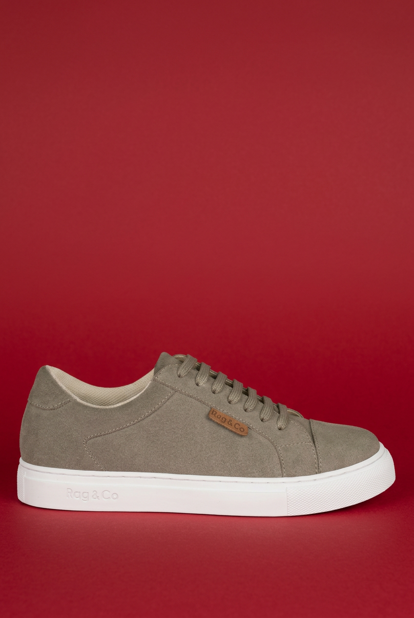Beige Ashford sneaker side view on red background
