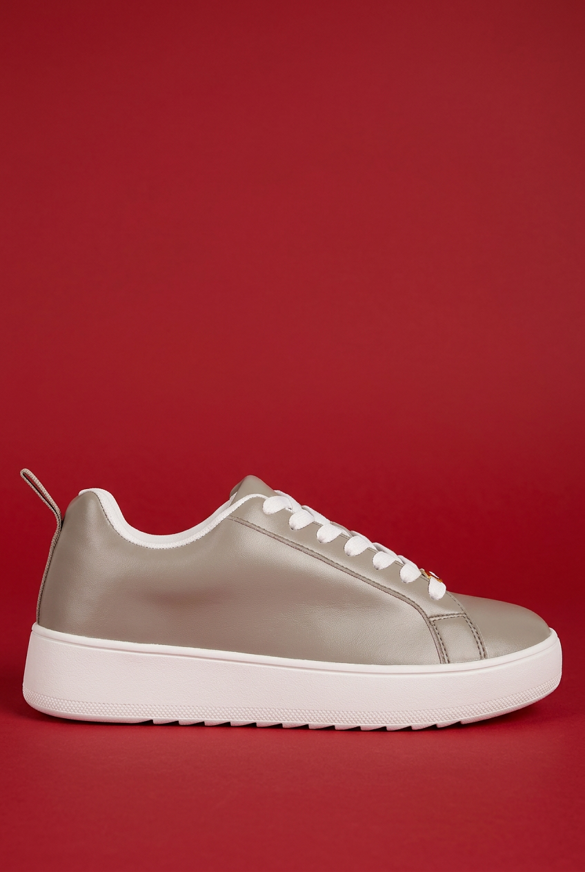Taupe Rouxy sneaker on red background
