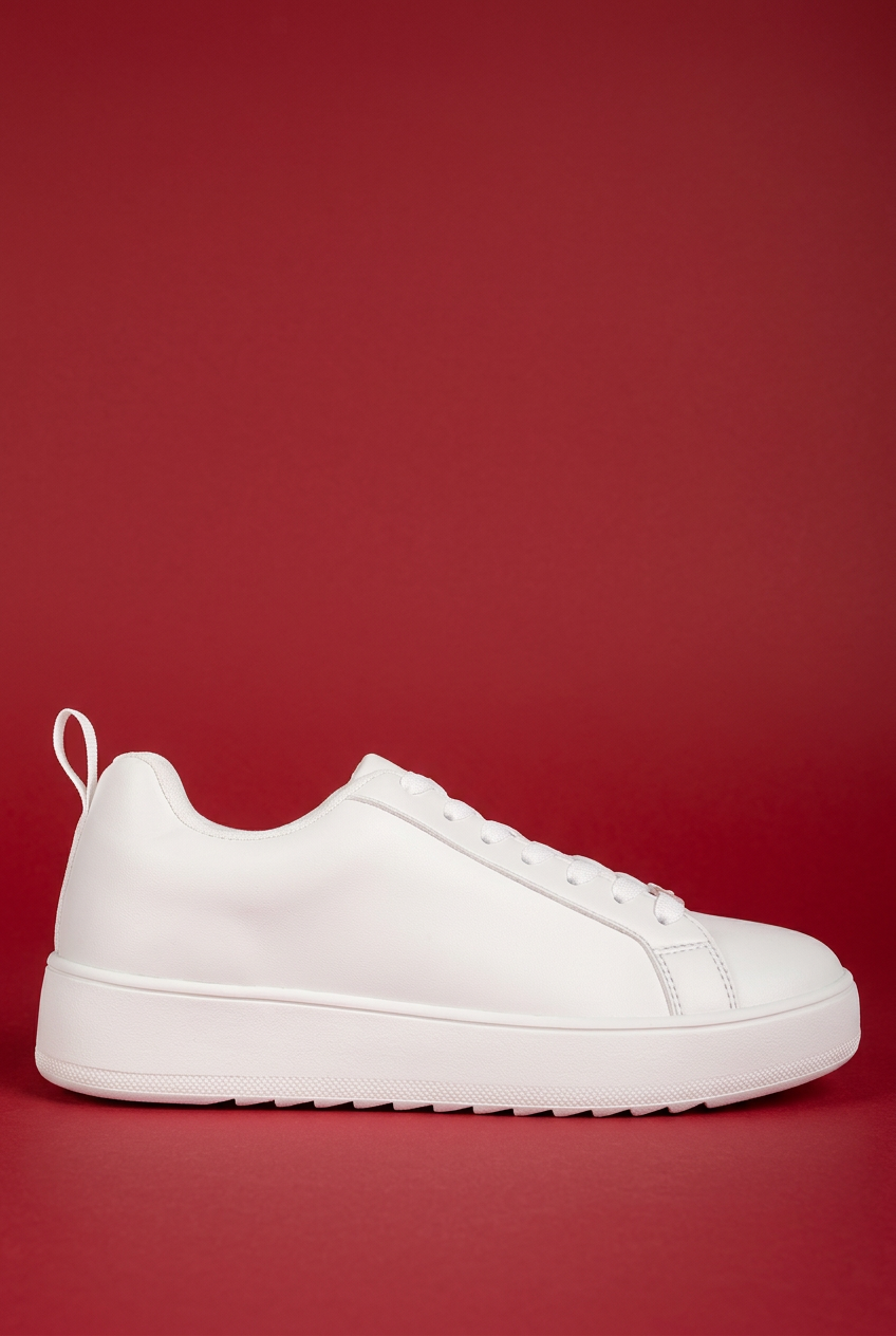 White Rouxy sneaker on red background
