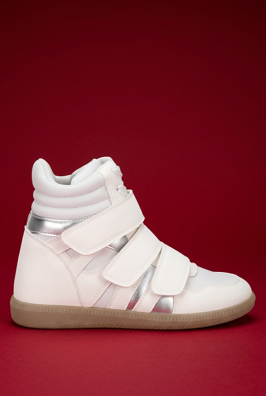White high-top wedge sneaker side view on red background