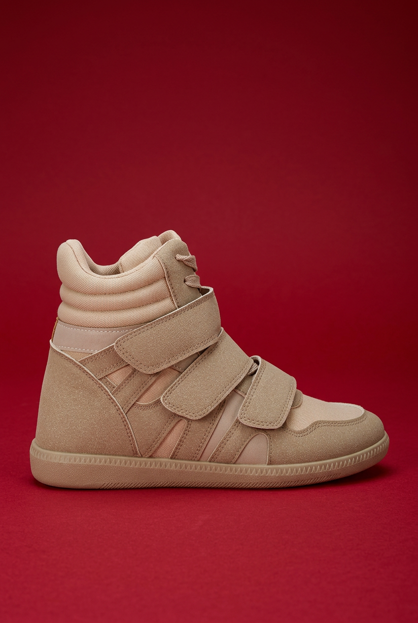 Taupe sneaker on red background