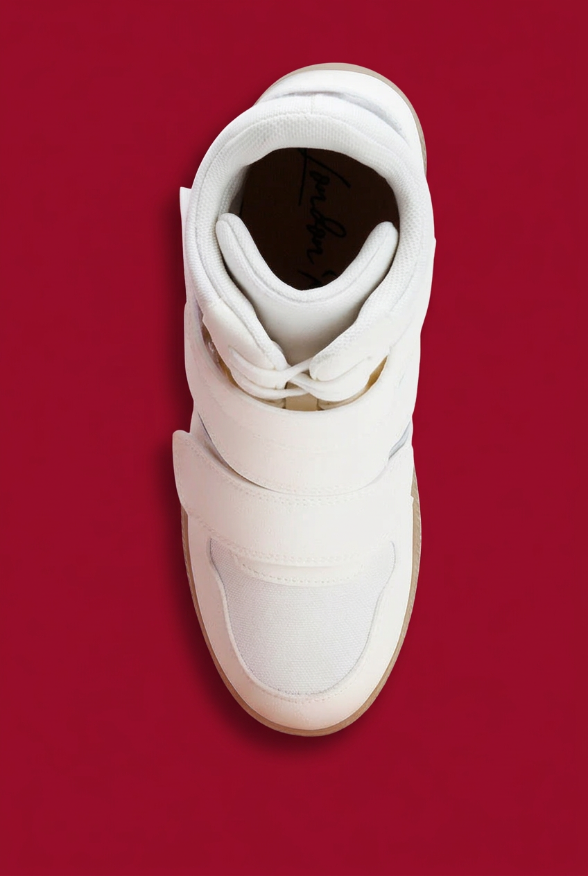 White sneaker top view on red background